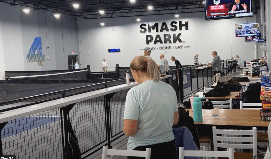 Players enjoying a game of pickleball at Smash Park, a top destination for indoor entertainment in La Vista.