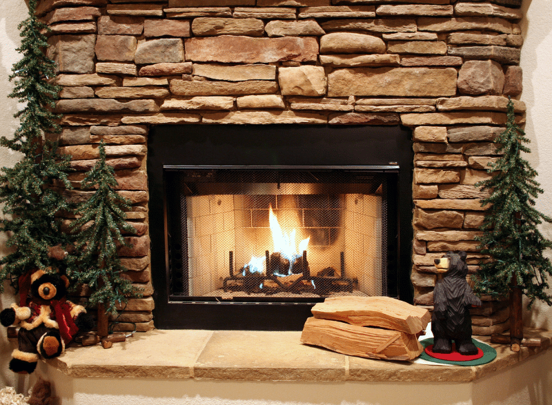 Cozy fireplace with minimal holiday decor for selling your home in winter.